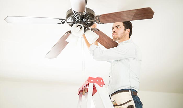 Handyman installing a Ceiling Fan
